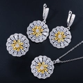 Macro detail of sunflower jewelry set featuring yellow zircon and silver metal finish - Yellow