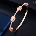 Rose gold fashion bangle with rectangular AAA zircon clusters and pave setting on dark base - Bangle / Rose Gold