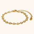 Verstellbares Edelstahl-Armband mit 18K Goldbeschichtung und weißen Emaille-Blumen - Weißes Gänseblümchen (Armband)