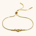 Verstellbares Gold-Schlangenkette-Armband mit einem runden grünen Zirkon-Mittelstück - Gold-Olivgelb Zirkonia