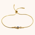 Verstellbares goldenes Schlangenkette-Armband mit einem runden blauen Stein in Fassung - Gold-Dunkelblau Zirkonia