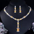 Close-up of silver-plated jewelry set with sparkling yellow zircon and pave diamonds - Yellow