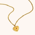 18K vergoldete Edelstahl Herz Halskette mit rotem Zirkon und Sternenstrahl-Detail - Januar/Granat Farbe