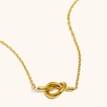 Polished 18K gold plated stainless steel necklace with minimalist knot pendant - Gold