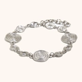 Bracelet en acier argenté avec breloques spirales concentriques et fermoir mousqueton - Bracelet Fossile de Conque - Couleur Acier