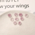 Macro detail of 8mm translucent resin camellia flower nail charms with glitter center - 8mm / Purple