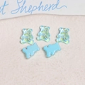 Macro shot of 5 mini 3D resin bears for DIY nail art including iridescent and matte styles - 1 Piece / Blue