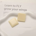 Close-up of cream square resin cabochons for DIY earrings on a white wavy plate - 1 Piece / Off White