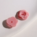 Macro detail of small pink resin flower beads with hollow holes for DIY jewelry - Small Pink