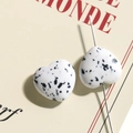 Macro view of heart-shaped spotted resin beads with pre-drilled holes for DIY jewelry - White