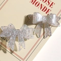 Detailed view of translucent acrylic butterfly hair clips with colorful glitter sequins - Silver