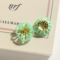 Detailed view of light green beaded flower earrings with gold center and metal base - 1 Piece / Green