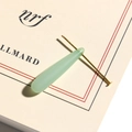 Detailed macro view of a translucent pale green teardrop pendant with gold metal pin - Large / Green
