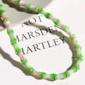 Macro shot of green and white bamboo-shaped millefiori glass beads for DIY jewelry - 1 Piece/Pack / Green