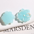 Detail of light blue resin flower charms showing front and back for DIY crafts - White Blue