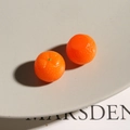 Detailed view of miniature resin orange charms with realistic peel texture for DIY jewelry - Orange Style