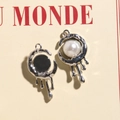 Detail of silver liquid metal alloy charms with white pearl and black resin inlays - Silver White Pearl