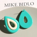 Detailed view of color-block water drop resin earrings in green and off-white - Blue White