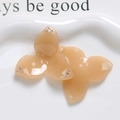 Close-up of peach jelly translucent resin flower charm with sparkling rhinestones - Orange One Piece