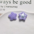 Macro shot of purple plush star DIY craft accessories with silver star button details - Purple