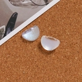 Macro detail of iridescent glitter moon resin charms for DIY jewelry and hair accessories - Moon Style