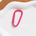 Detail of bright pink D-shaped aluminum spring buckle for DIY keychains and bags - Rose Red