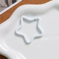 Close-up of white star-shaped alloy spring clasp for DIY keychain jewelry making - White