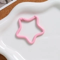 Pink star-shaped alloy spring clasp on a white cloud ceramic tray for DIY keychains - Light Pink