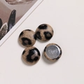 Close-up of leopard print fabric buttons with polished flat metal base for DIY jewelry - Beige Matte