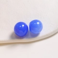 Detail view of two 20mm blue ink-wash resin round beads for DIY jewelry making accessories - Blue