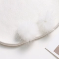 Macro shot of two soft white faux mink fur balls for DIY jewelry and hair accessories - Pure White