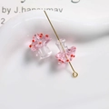 Macro shot of pink polka dot glass mushroom beads with gold pins for jewelry making - Pink with Red Polka Dots