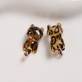 Macro shot of amber resin leopard print cat charms for DIY jewelry and phone accessories - Dark Coffee Cat One Piece