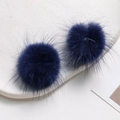 Close-up of fluffy dark blue mink fur pom-poms for DIY jewelry and hair accessories - Deep Blue-Purple