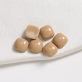 Macro shot of 6 khaki resin square cabochons with glossy finish for jewelry DIY - 1 Piece / Brown