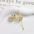 Macro detail of yellow translucent glass mushroom bead with blue dots and gold metal pin - Transparent Yellow with Blue Polka Dots