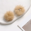 Detail view of two soft 3.5cm camel mink fur pom-poms for DIY jewelry and hair accessories - Light Coffee