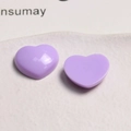 Detail view of two glossy purple heart-shaped acrylic charms for DIY jewelry accessories - Purple