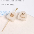 Macro detail of translucent resin ghost charms with gold bear and smiley face elements - Bear And Smile Face Set / White