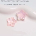 Close-up of pink glittery star-shaped resin charms on white ceramic plate for DIY crafts - Deep Pink