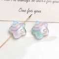 Macro view of macaron star beads with heart patterns and perforated resin DIY details - White Green