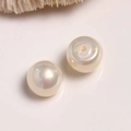 Macro view of creamy white round pearl beads for DIY jewelry and earring crafts - 1 Piece / Beige