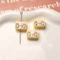Detail of macaron resin backpack charms with gold buckles for DIY jewelry making - Bright Yellow
