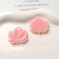 Macro detail of pink resin leaf charms with fine veins for DIY earring making - Pink