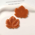 Detail of amber resin maple leaf charms with realistic vein textures for DIY jewelry - Brown