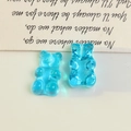 Detail of blue translucent gummy bear resin charms for DIY earring and jewelry making - Half Drilled / Blue