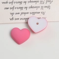 Close-up of matte heart-shaped acrylic beads for DIY earring crafts in pink and white - 1 Piece / Deep Pink