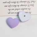 Macro detail of heart-shaped acrylic beads with a matte macaron finish for DIY jewelry - 1 Piece / Purple