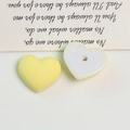 Detailed view of matte yellow and translucent white acrylic heart beads for DIY jewelry - 1 Piece / Bright Yellow