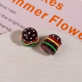 Macro detail of high-quality resin hamburger charms with layered colors for DIY jewelry - Dark Red